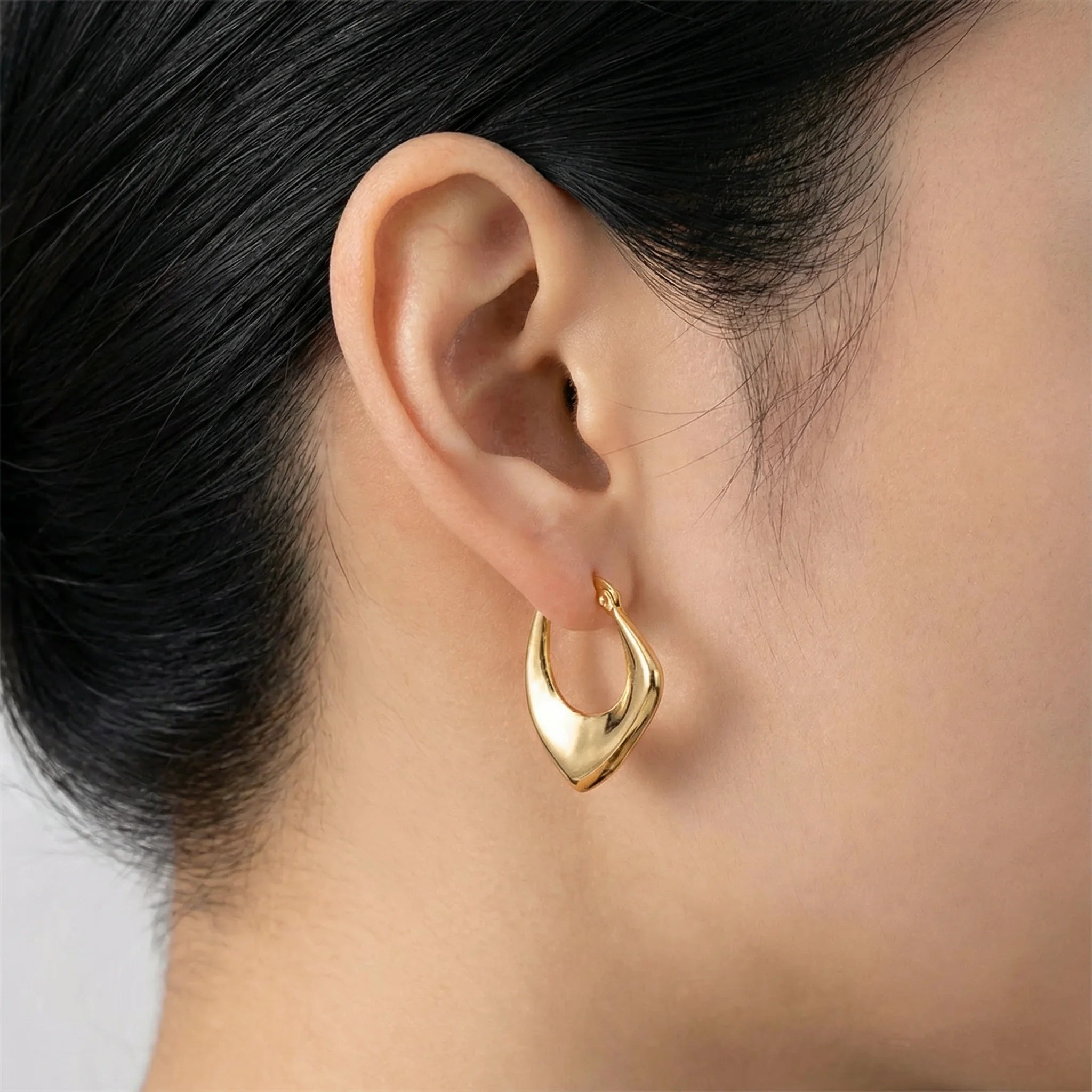 Close-Up of Frequency Paris-Ibiza Abundance Gold Hoop Earrings – Irregular Organic Shape Perfect for Everyday Wear with a Extra Elegance