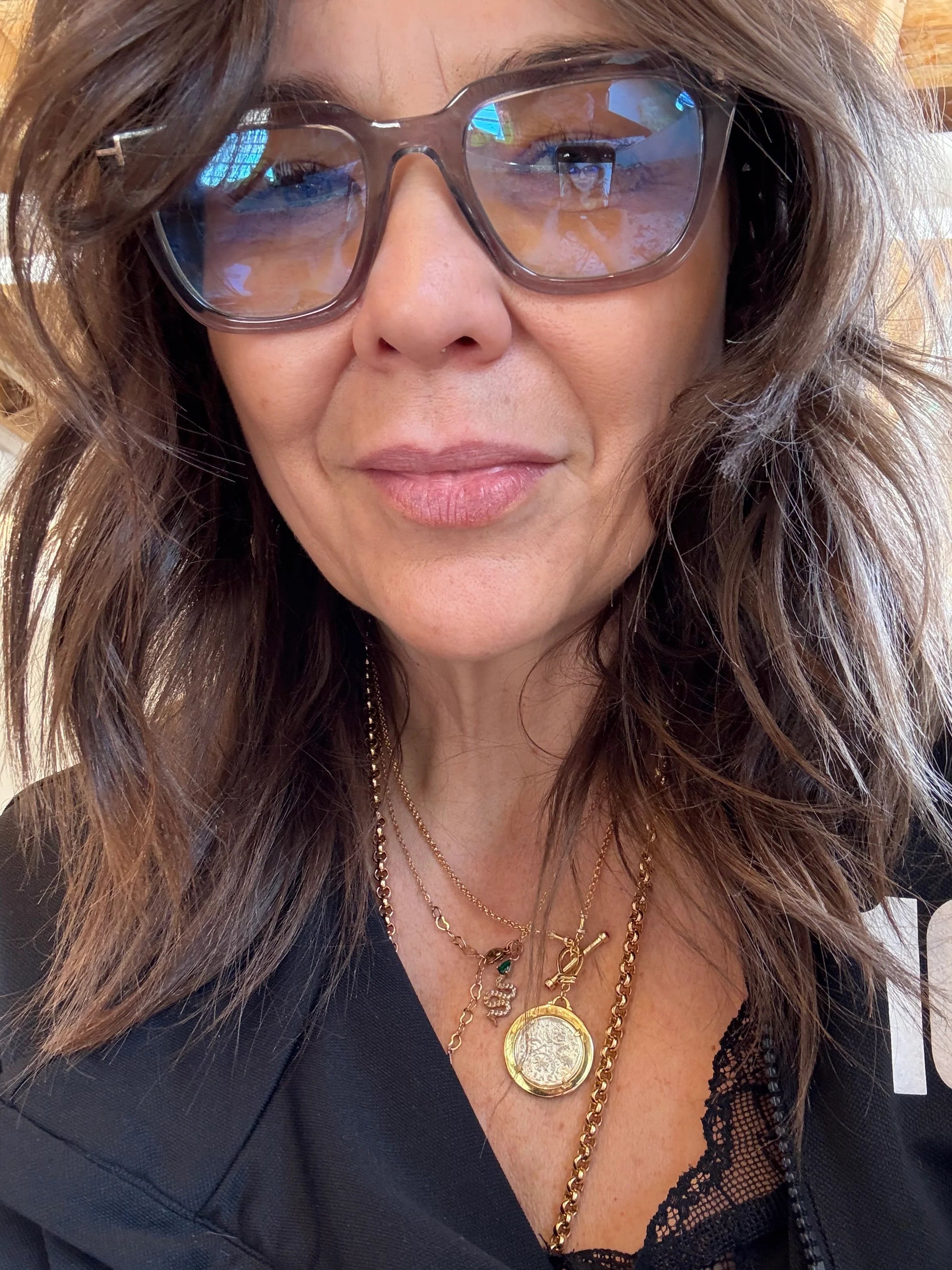 Customer photo of Charlotte wearing the Soul Purpose Gold Pendant Necklace in sterling silver with 18K gold plating by Frequency Paris-Ibiza