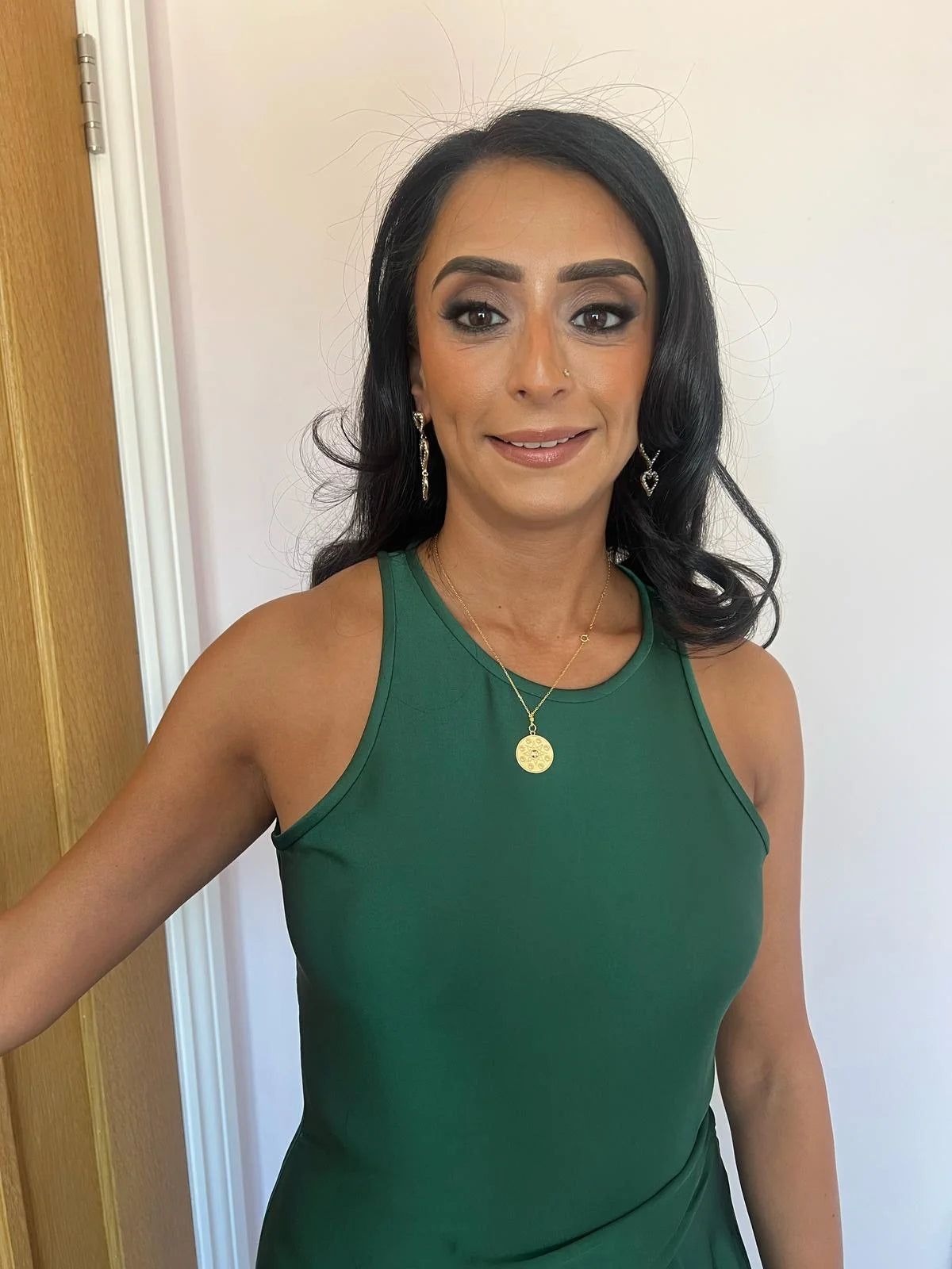 Customer photo of Mira wearing the Manifest Gold Pendant Necklace in sterling silver with 18K gold plating by Frequency Paris-Ibiza