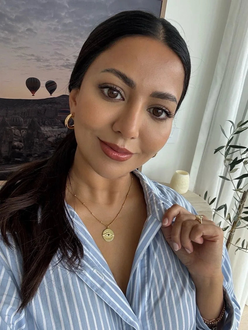 Customer photo of Sonia wearing the Protection Gold Pendant Necklace in sterling silver with 18K gold plating by Frequency Paris-Ibiza