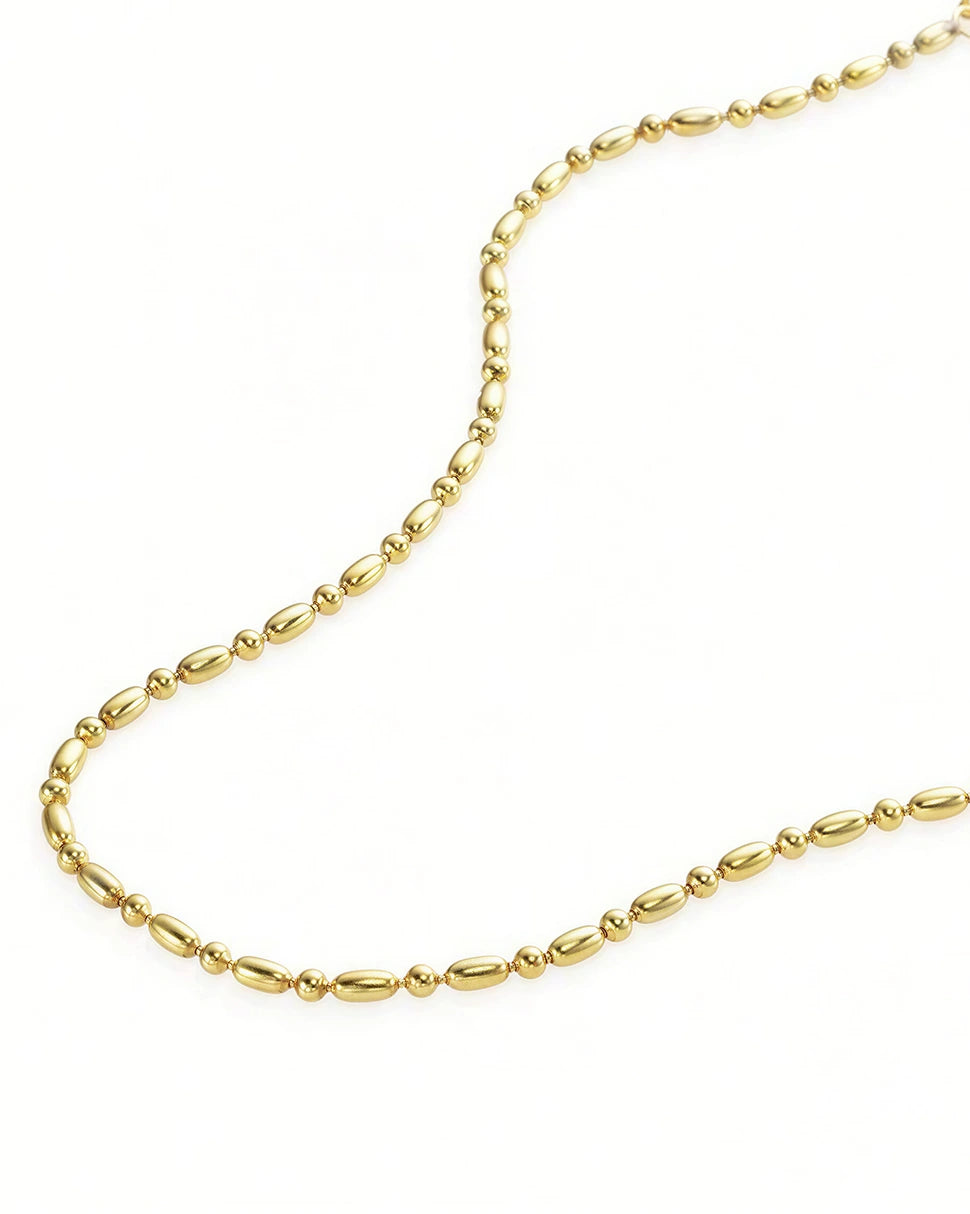 Elegant, chic, effortless - the best gold choker necklace and the perfect gift for her. The Eclipse Gold Beaded necklace by Frequency Paris-Ibiza. 