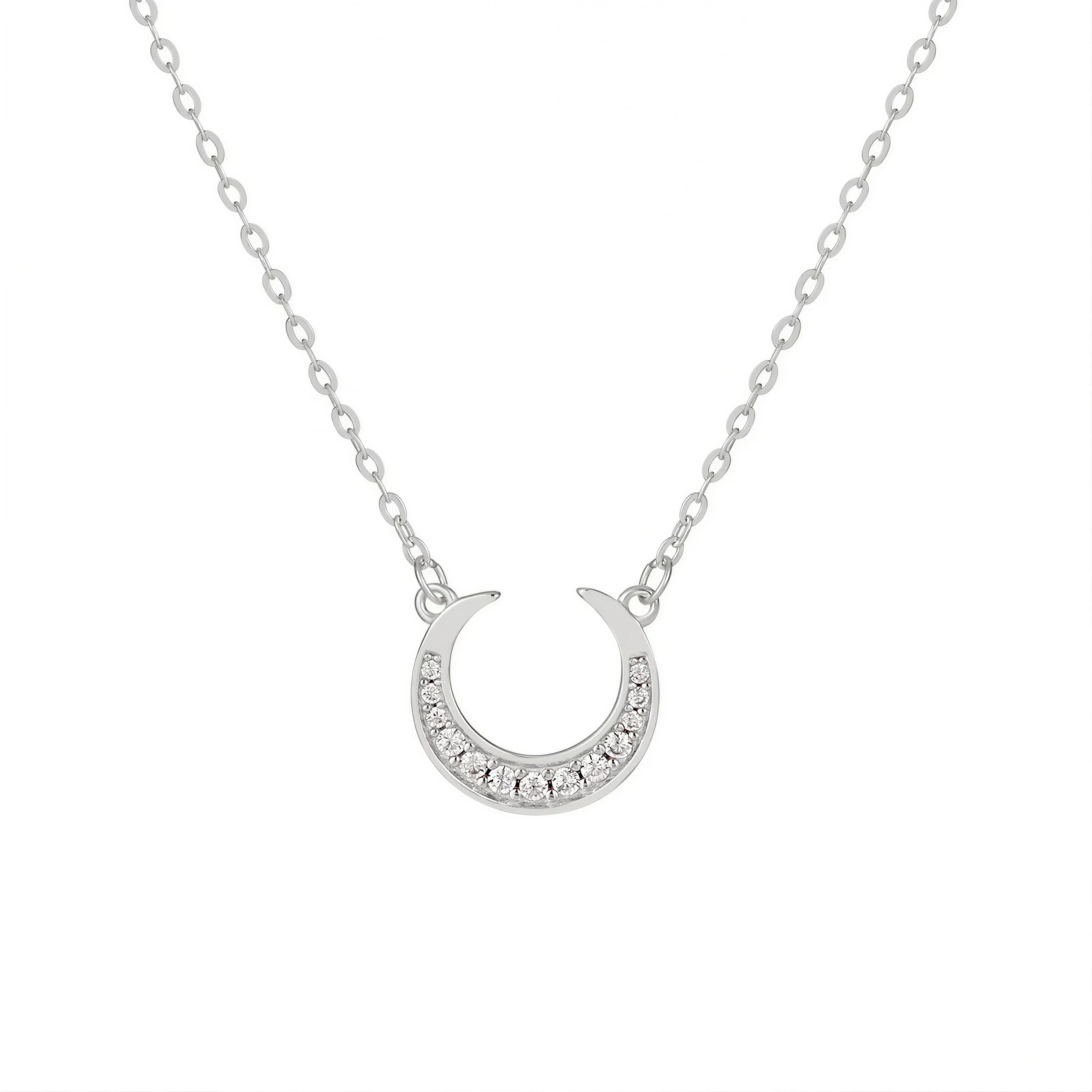 Dreamscape Silver Pendant Necklace by Frequency Paris-Ibiza — celestial crescent moon pendant with zircon crystals on white background, highlighting exquisite detail.