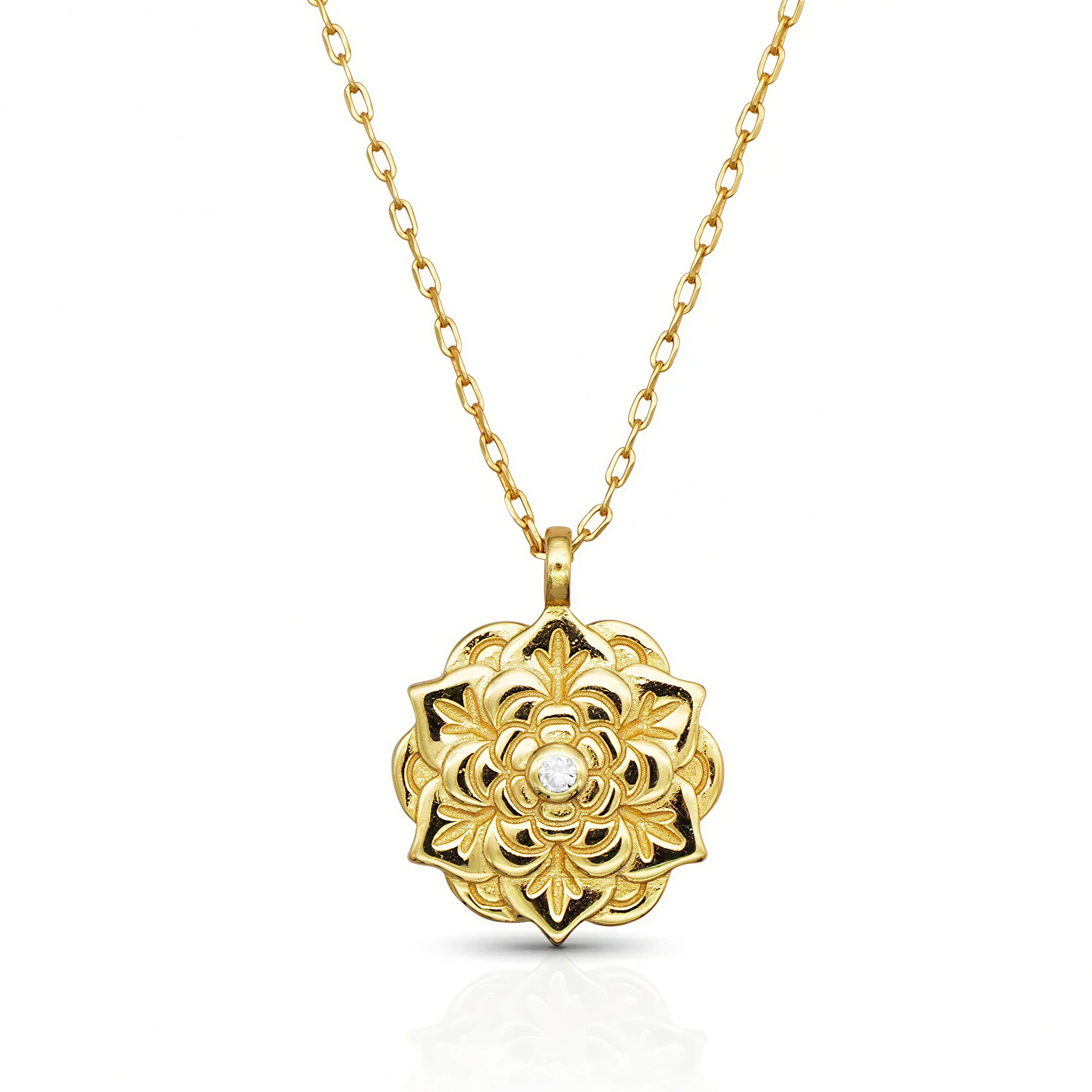 Empowerment Gold Pendant Necklace by Frequency Paris-Ibiza, on white background — floral design with central crystal on gold chain. 
