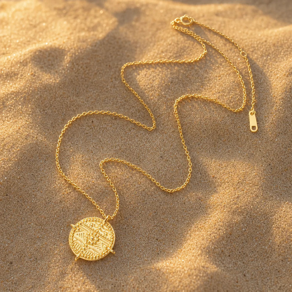 Es Vedrà gold pendant necklace detail, highlighting coin design, 18k gold plated sterling silver, talisman jewellery. Shop now at Frequency Paris-Ibiza