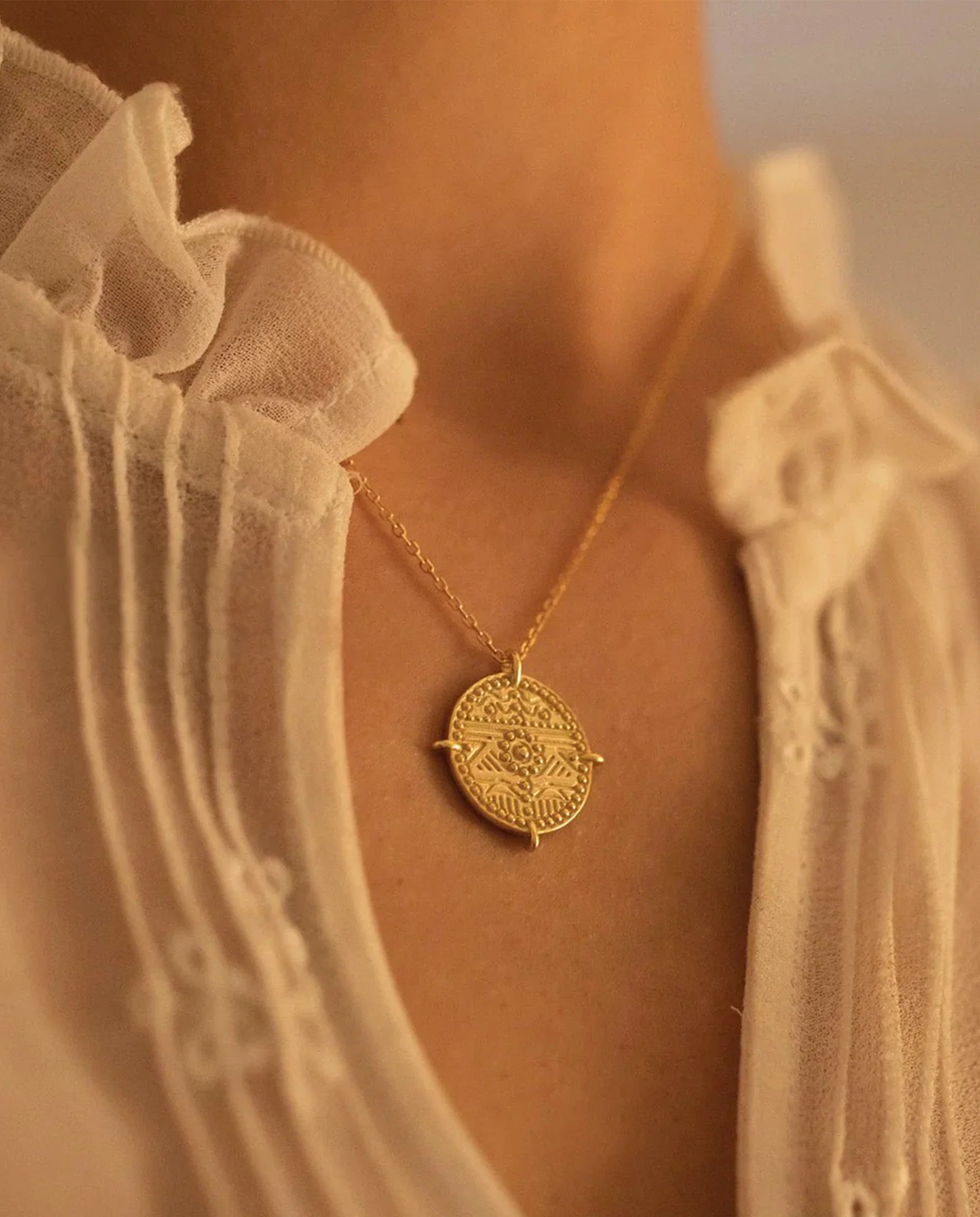 A close up of the stunning pendant detail - 18k Gold plating on premium sterling silver. Es Vedrà Gold Pendant Necklace by Frequency Paris-biza.
