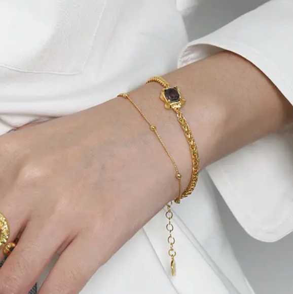 Frequency Paris-Ibiza Alchemy Chain Bracelet close-up in gold, showing zircon crystal detail and double chain design