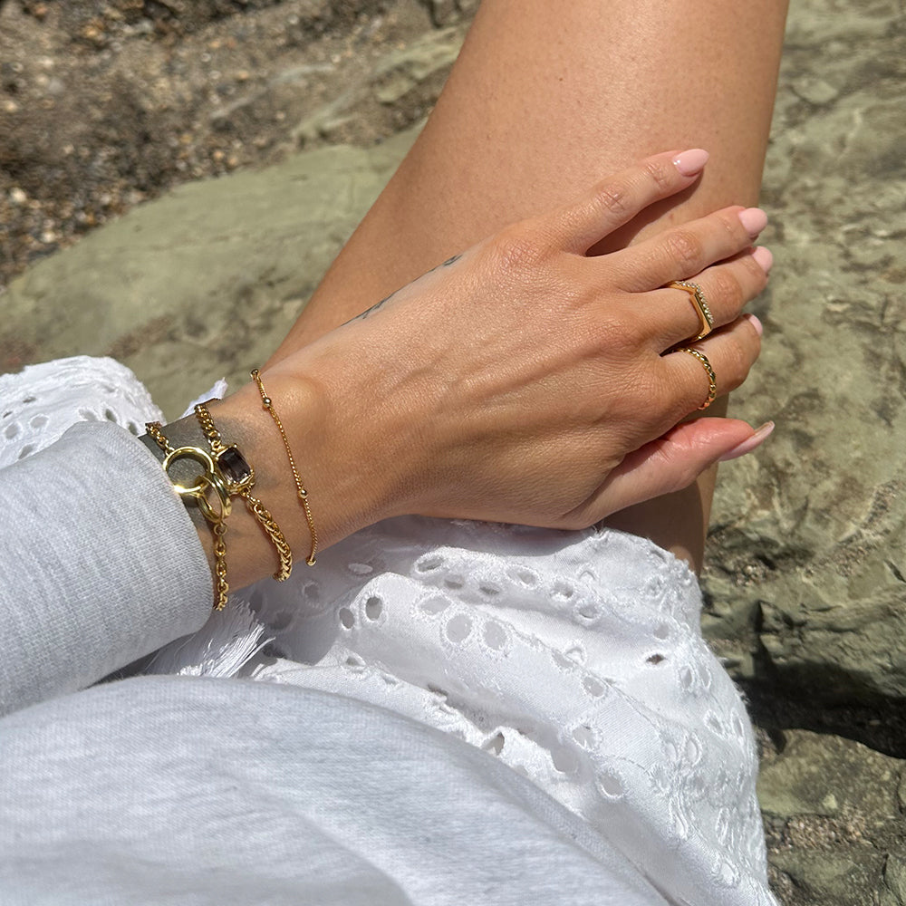 Frequency Paris-Ibiza Alchemy Chain Bracelet in gold styled with Infinite Possibilities Bracelet and gold rings for stunning luxe style