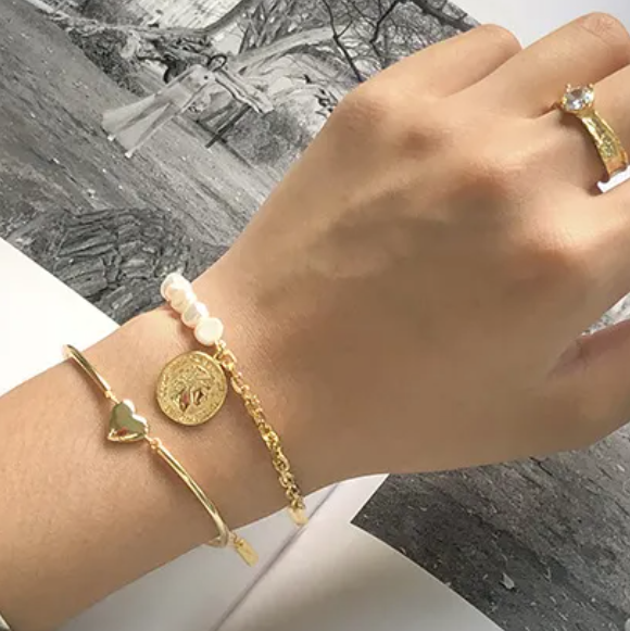 Wisdom Coin Charm Bracelet – 18k gold plated with slim bracelet stacked on wrist – Frequency Paris-Ibiza