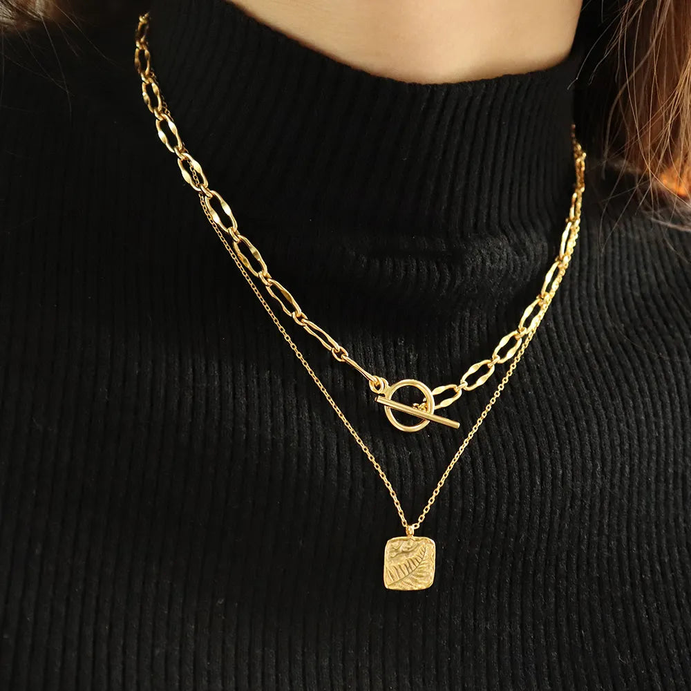 Burning Desire 18k gold plated T-Bar necklace styled in layers, versatile bold jewellery for everyday elegance. Frequency Paris-Ibiza