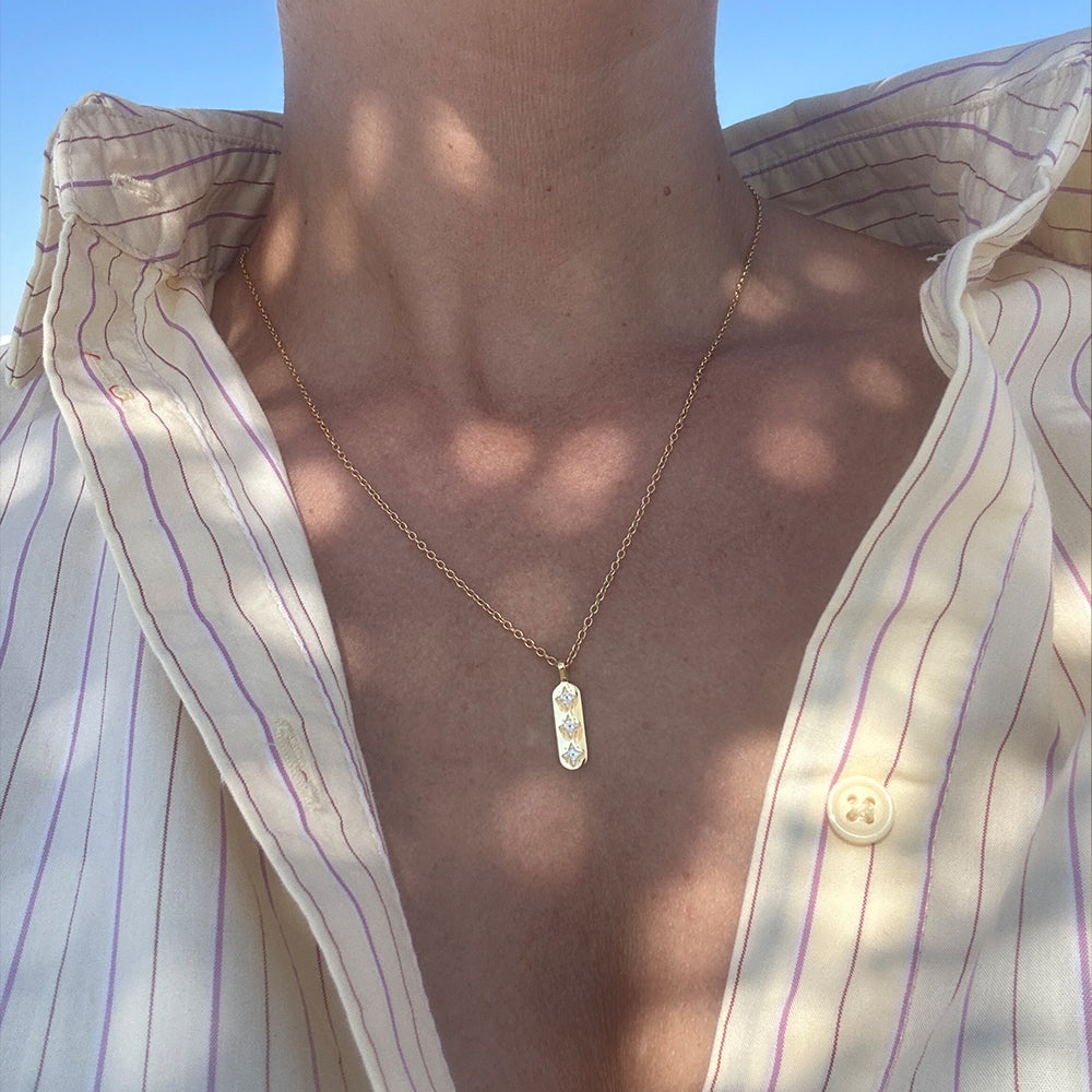 Close-up of Guiding Light gold pendant necklace, 18k gold plated sterling silver, designed to inspire personal intention and empowerment. Frequency Paris-Ibiza