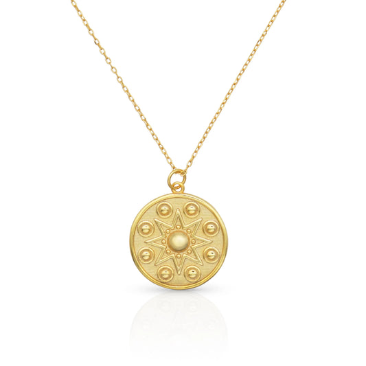 Manifest Gold Pendant Necklace — a circular pendant with a star motif design, by Frequency Paris-Ibiza.