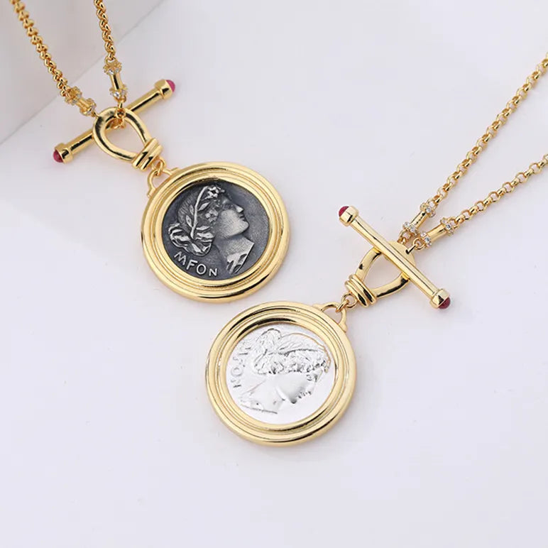 Soul Purpose Gold Pendant Necklace in silver and grey coin finishes. Frequency Paris-Ibiza