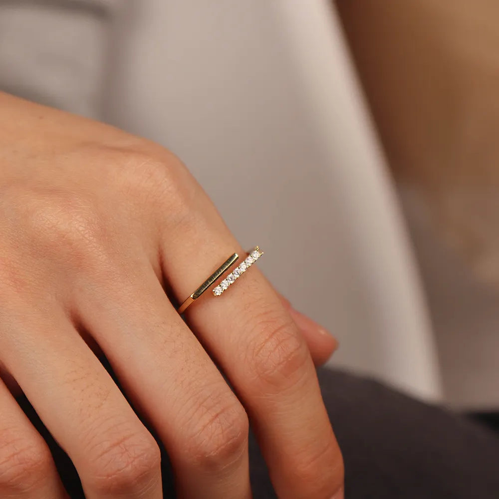 Frequency Paris-Ibiza Cosmic Trust Ring in gold worn on a model, showcasing contemporary minimalist style, versatile for day-to-night wear