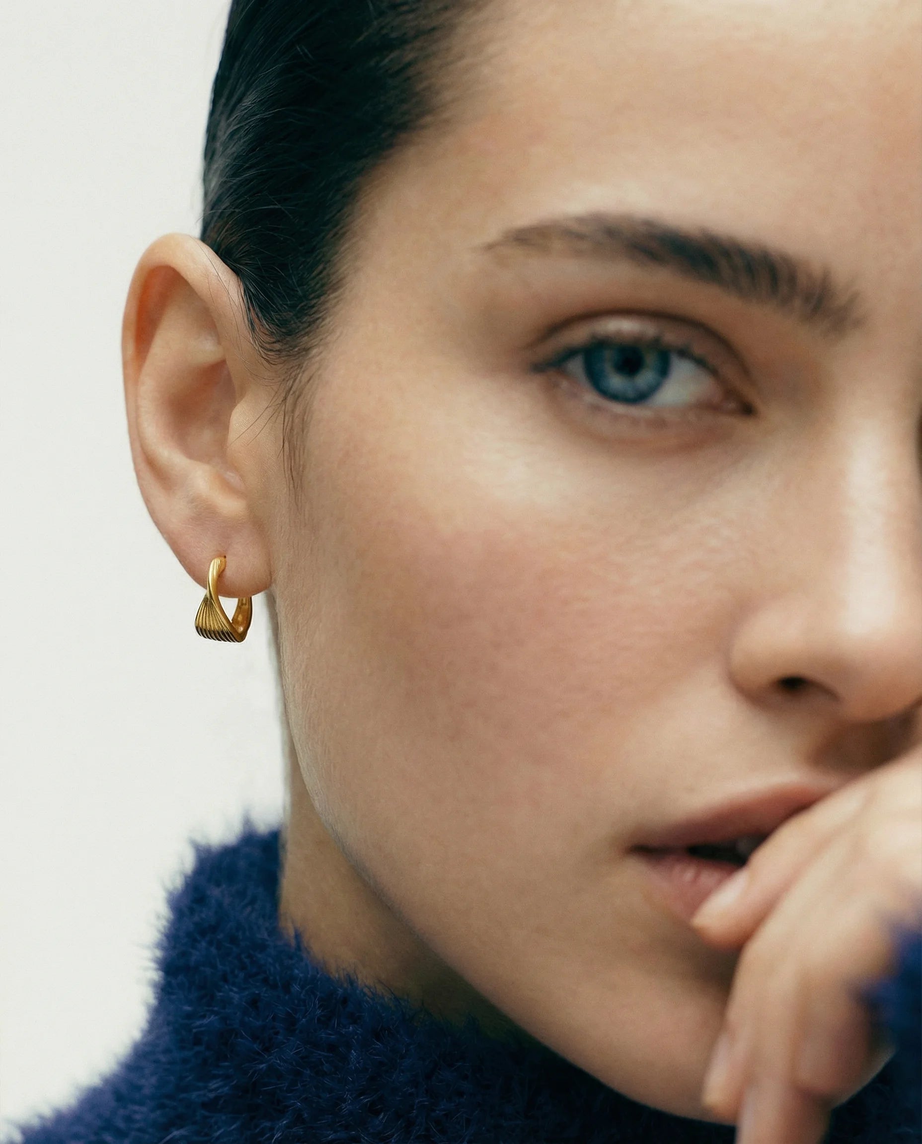 Frequency Paris-Ibiza Eternal Wave Gold Hoop Earrings worn by model, showing premium quality and versatile day-to-night wear