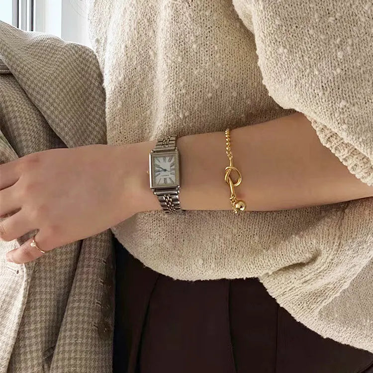 Gold Presence Beaded Chain Bracelet by Frequency Paris-Ibiza worn on wrist, chic minimalist styling, ideal for stacking or solo wear.