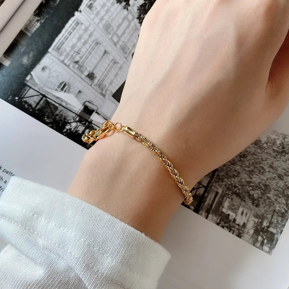 Frequency Paris-Ibiza Higher Self Gold Rope Chain Bracelet worn on wrist, showing styling options for solo wear or as a layered arm stack.