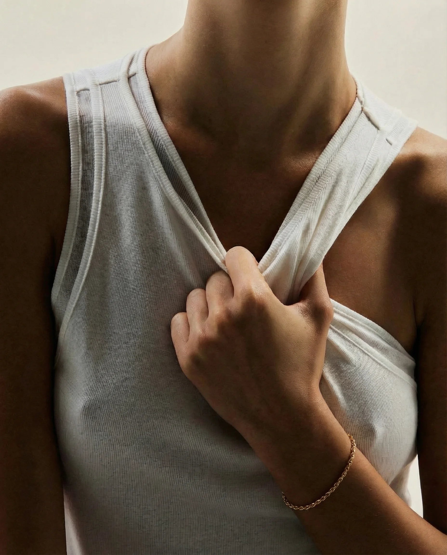 Higher Self Gold Rope Chain Bracelet by Frequency Paris-Ibiza, worn with a sexy white vest. Day to night jewellery box staple. 