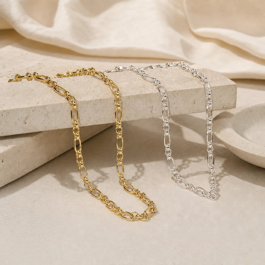 Close-up of Majestic Chain Necklaces in gold and silver finishes showing detailed chain links and refined craftsmanship. Frequency Paris-Ibiza