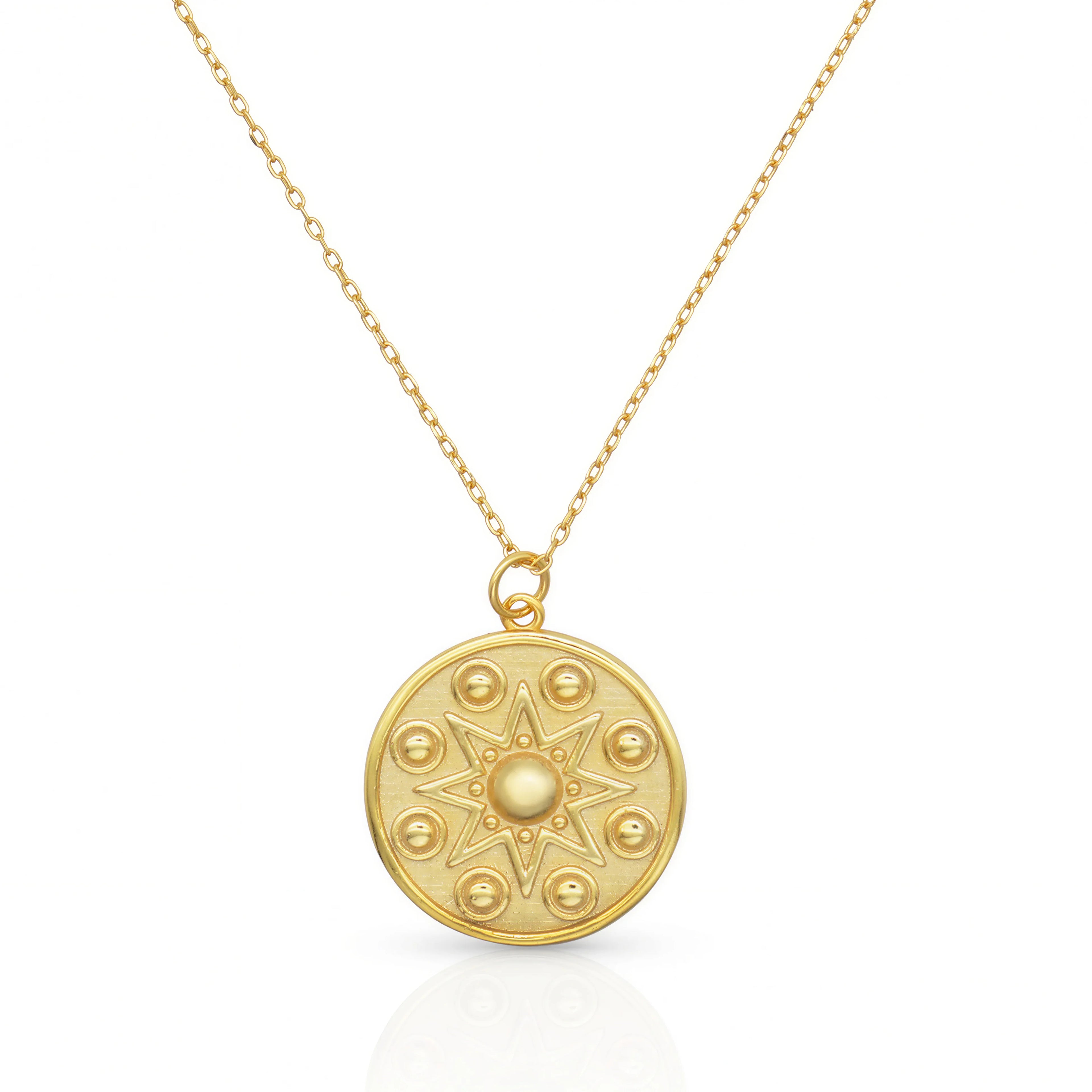 Manifest Gold Pendant Necklace — a circular pendant with a star motif design, by Frequency Paris-Ibiza.