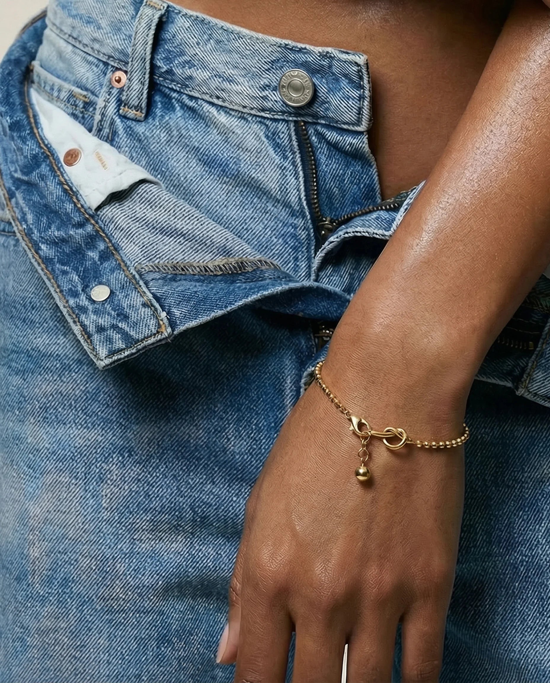 Gold Presence Beaded Chain Bracelet by Frequency Paris-Ibiza worn on wrist, chic minimalist styling, ideal for stacking or solo wear.