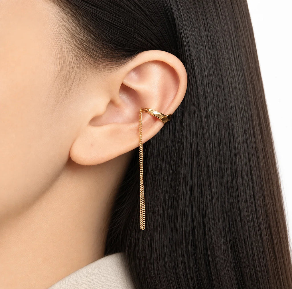 Frequency Paris-Ibiza Quantum Ear Cuff in 18K gold-plated sterling silver worn on the middle of the ear. Chic, edgy chain drop design perfect for stacking or solo wear.
