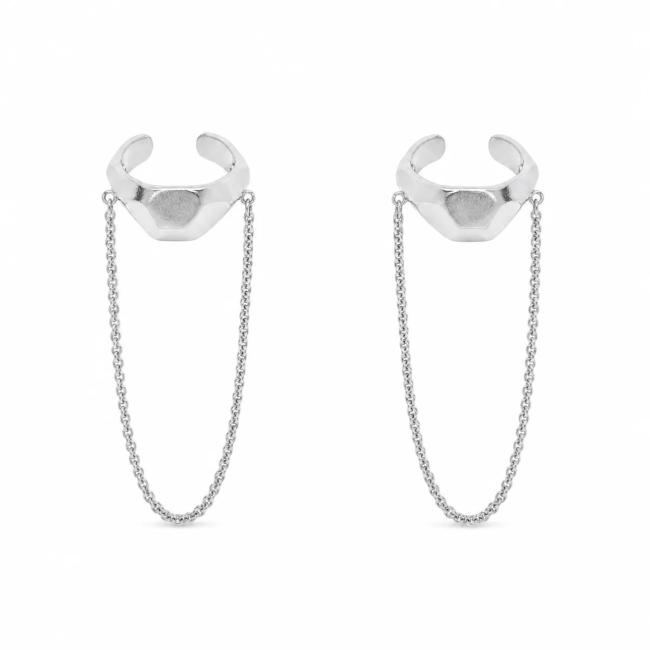 Close-up of Frequency Paris-Ibiza Quantum Ear Cuff in rhodium-plated sterling silver. Shows detailed craftsmanship, hammered texture, and edgy chain drop design.