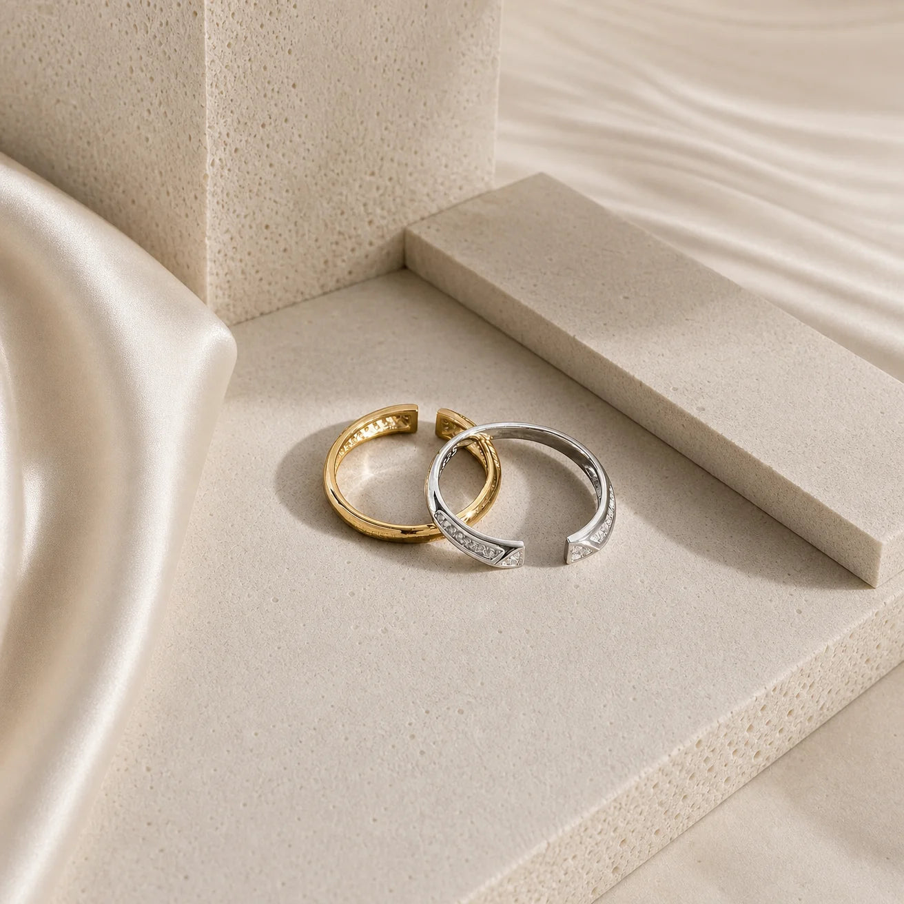 Gold and silver Frequency Paris-Ibiza Resonance Ring shown together highlighting premium craftsmanship and adjustable band design