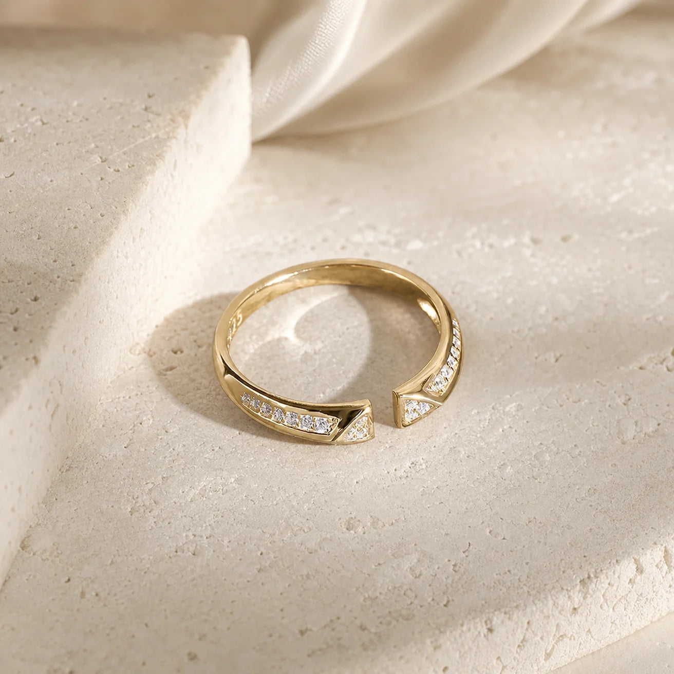 Close-up of the Frequency Paris-Ibiza Resonance Ring showing two triangle shapes with zircon crystals and crystal accents along the band, contemporary craftsmanship