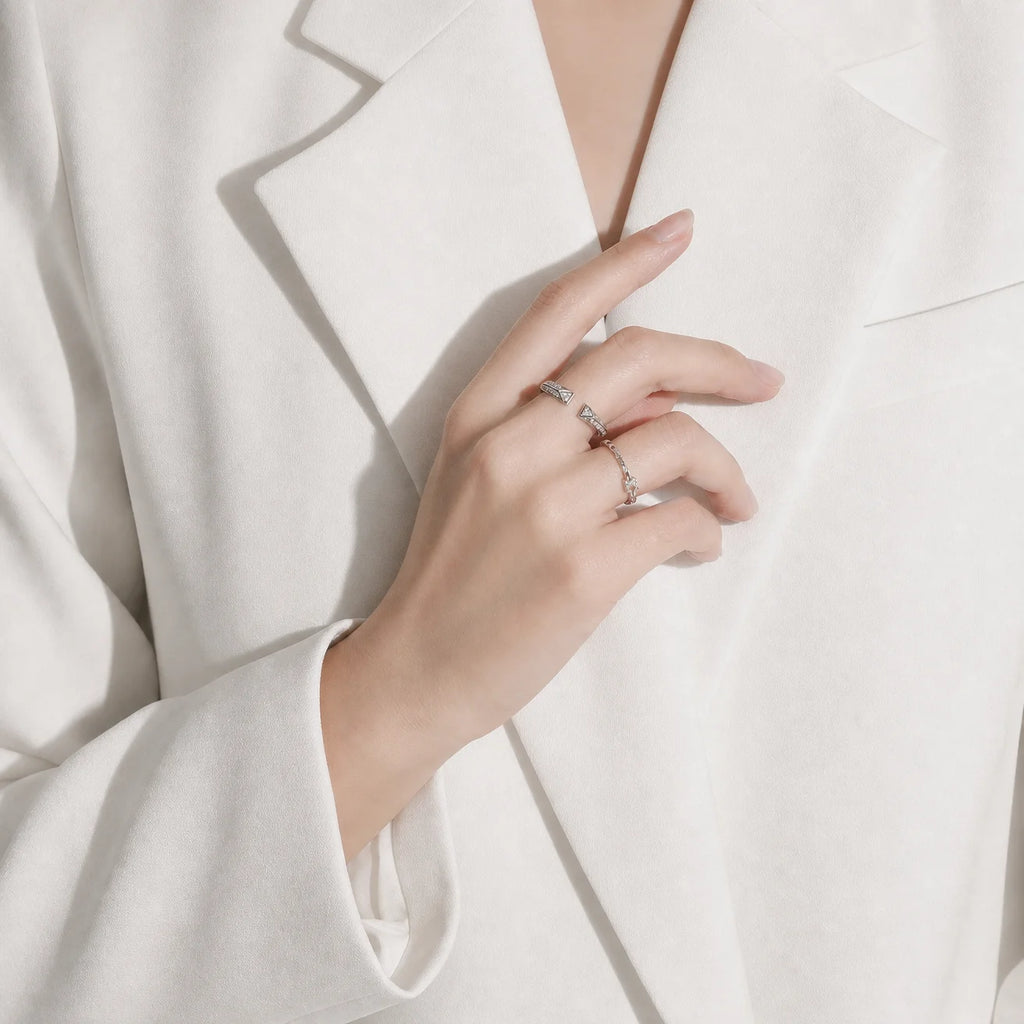 Model wearing the Frequency Paris-Ibiza Resonance Ring in rhodium plated sterling silver, perfect for silver jewellery lovers