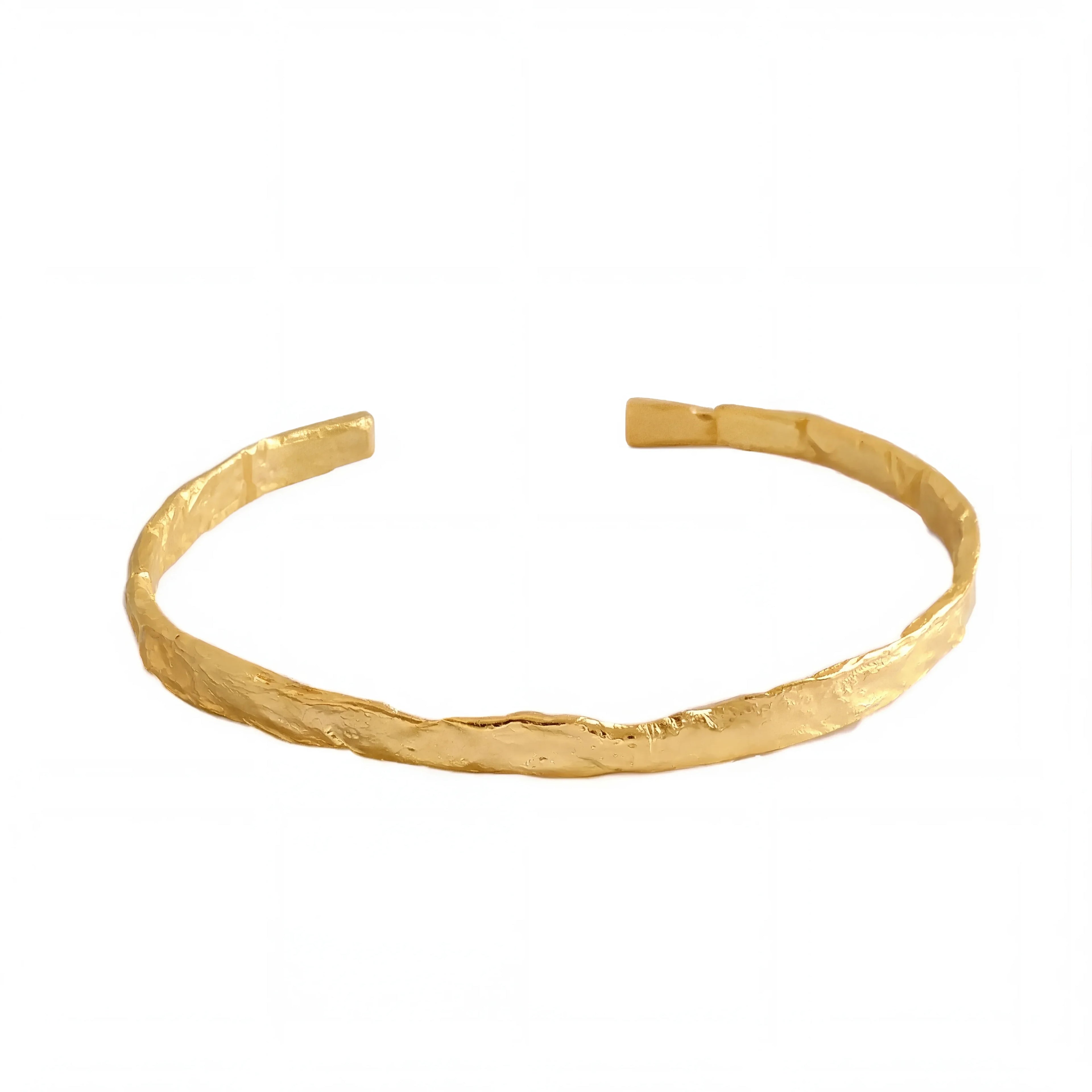 Frequency Paris-Ibiza So Hum gold cuff bracelet on white background showing minimalist hammered design