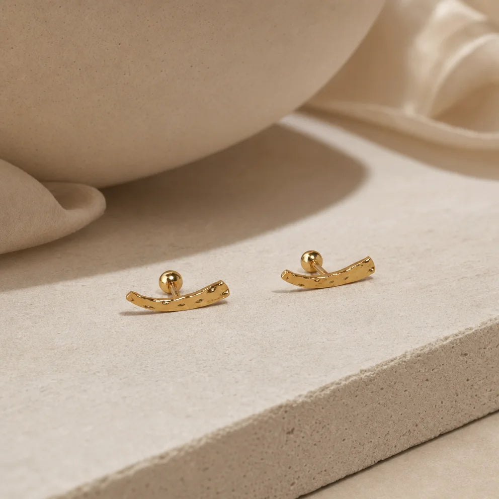 Frequency Paris-Ibiza Soluna Gold Stud Earrings close-up, showing irregular hand-hammered texture, 18K gold plated sterling silver, minimalist style