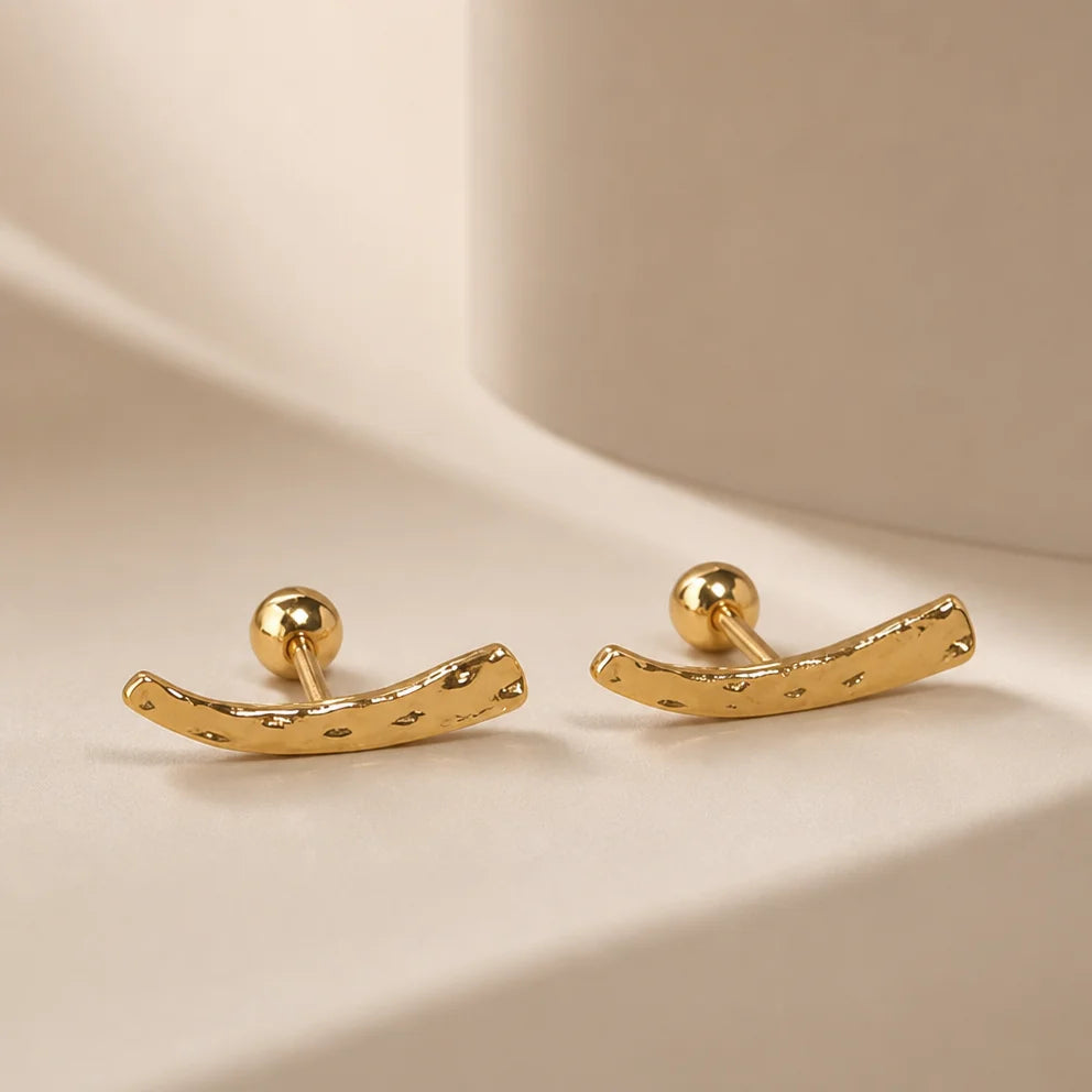 Frequency Paris-Ibiza Soluna Stud Earrings close-up, showing irregular hand-hammered texture, 18K gold plated sterling silver, minimalist style
