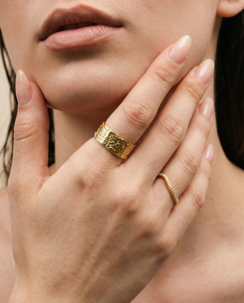 Close-up of the Gaia Ring by Frequency Paris-Ibiza, showcasing its hammered organic texture in 18k gold-plated sterling silver. The unique texture captures the raw beauty of nature, offering a contemporary yet earthy design.