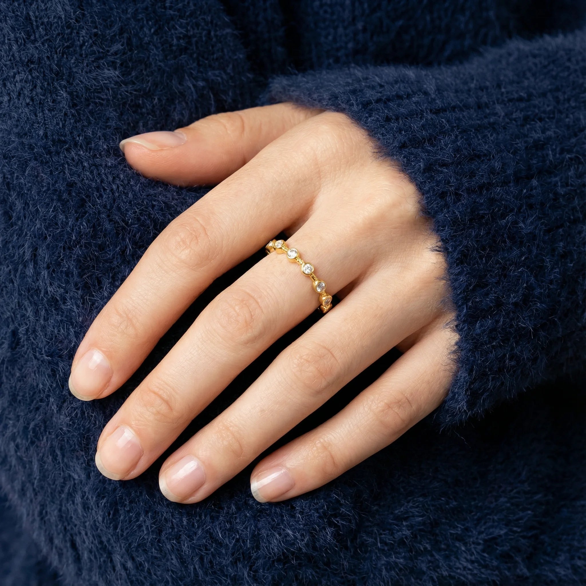 Close-up of Gratitude Ring worn on a model, elegant and chic design, perfect to wear alone or stack, 18K gold plated sterling silver by Frequency Paris-Ibiza