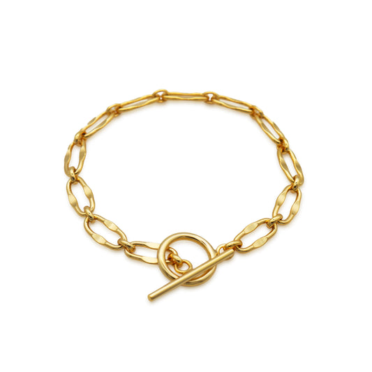 Burning Desire gold T-bar bracelet by Frequency Paris-Ibiza on white background