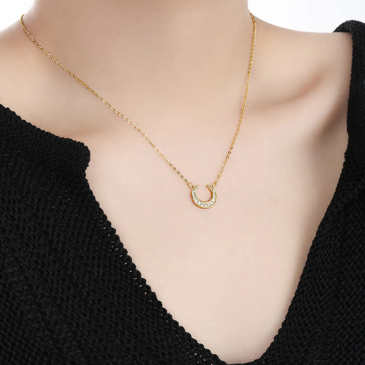 Dreamscape Gold Pendant Necklace by Frequency Paris-Ibiza — worn on model, showcasing delicate celestial crescent moon design with sparkling zircon crystals.