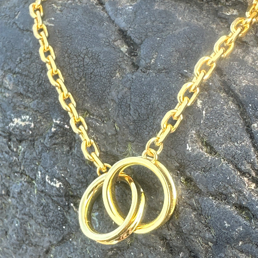 Close-up of Frequency Paris-Ibiza Infinite Possibilities Gold Chain Bracelet showing interlocking circles, craftsmanship, and chain details