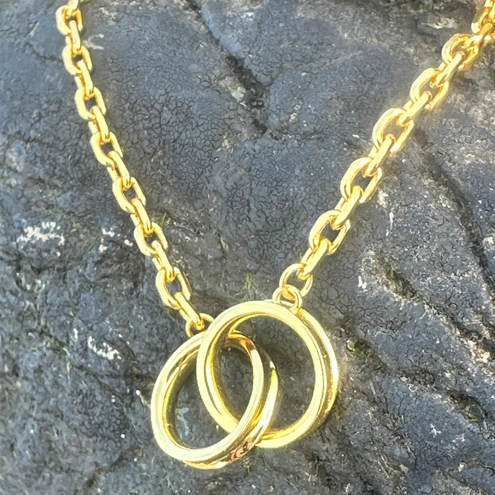 Close-up of Frequency Paris-Ibiza Infinite Possibilities Gold Chain Bracelet showing interlocking circles, craftsmanship, and chain details