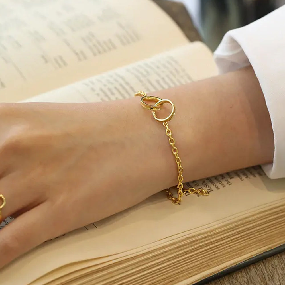 Frequency Paris-Ibiza Infinite Possibilities Gold Chain Bracelet worn on wrist, highlighting interlocking circles and chain design