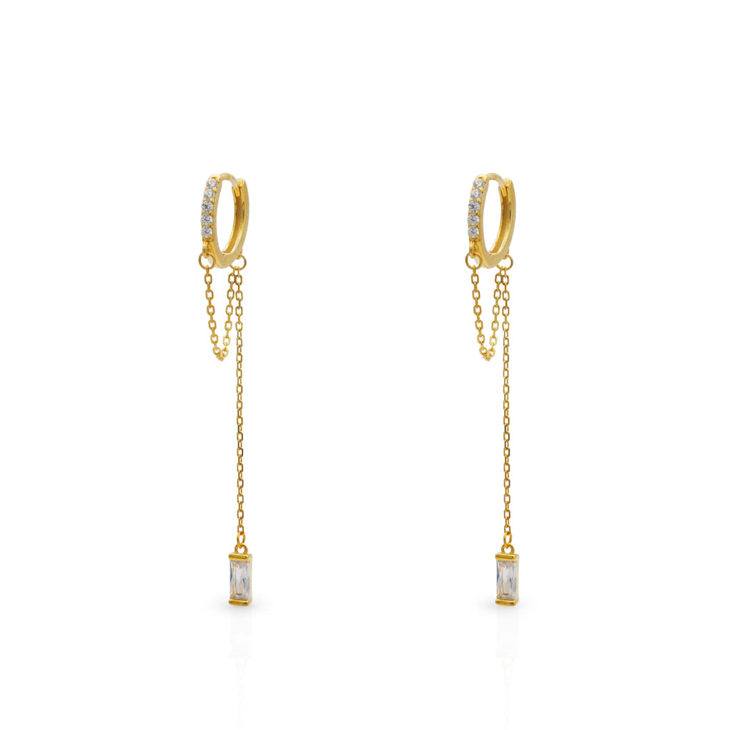 Frequency Paris–Ibiza Infinity Chain Earrings in 18K gold with crystal drops and delicate chain tassels, photographed on a white background.
