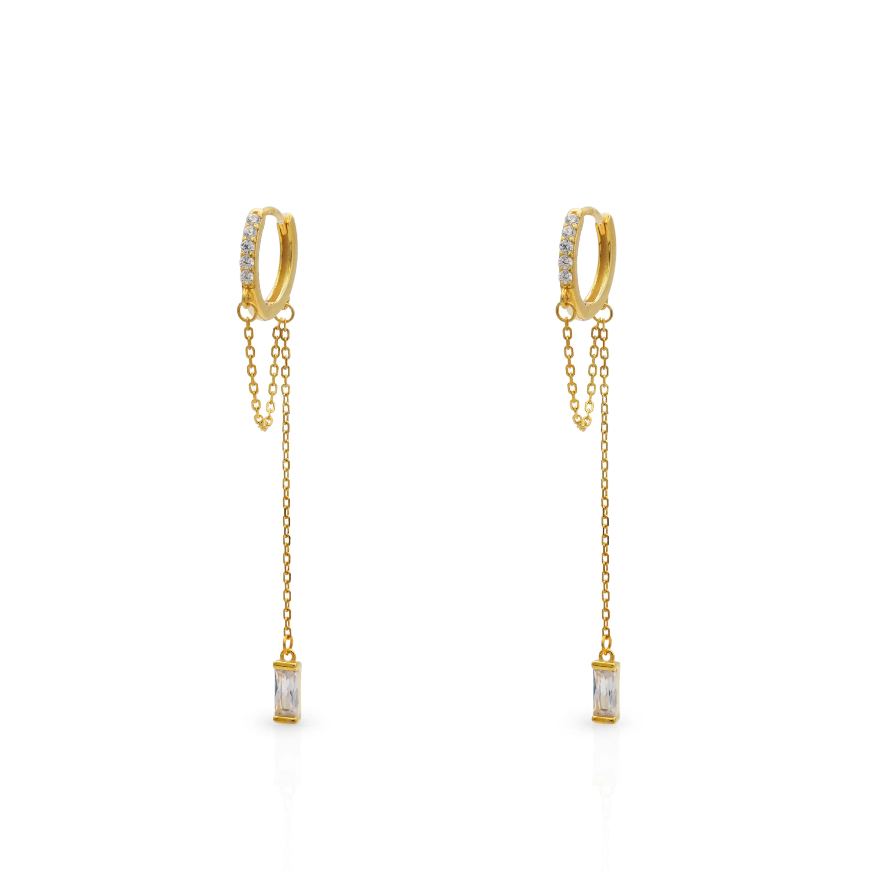 Frequency Paris–Ibiza Infinity Chain Earrings in 18K gold with crystal drops and delicate chain tassels, photographed on a white background.
