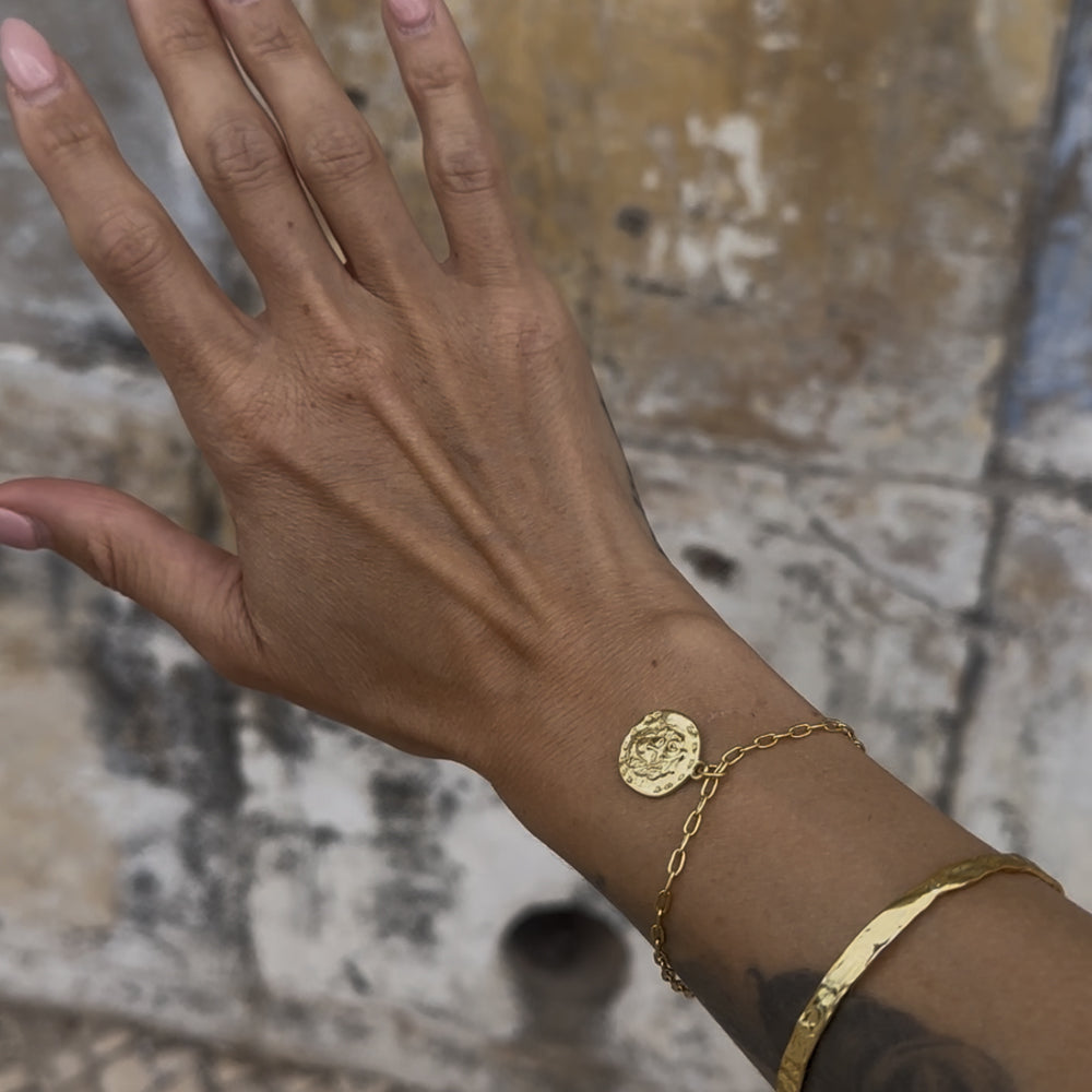 Frequency Paris-Ibiza L'Amour Gold Chain Bracelet stacked with So Hum bracelet showing coin charm size and chain link detail