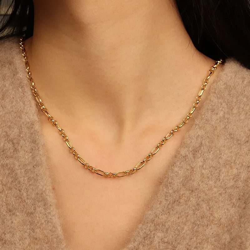 Majestic Gold Chain Necklace styled with a cosy sweater — stylish, versatile gold chain perfect for everyday wear. Frequency Paris-biza