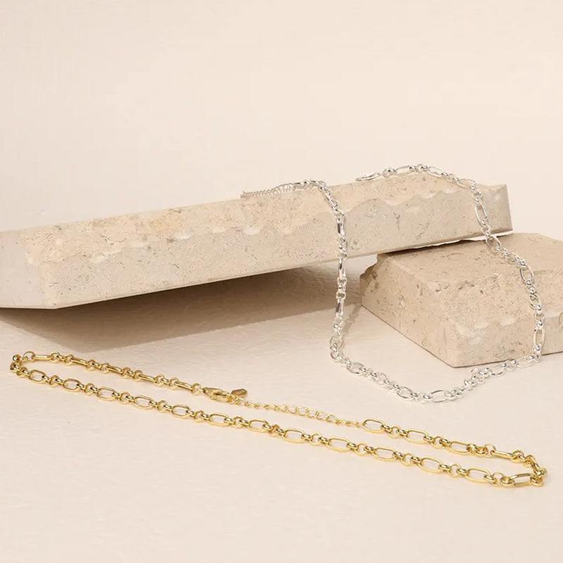 Majestic Chain Necklaces by Frequency Paris-Ibiza in gold and silver finishes displayed together — classic, versatile style.