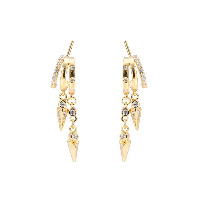 Frequency Paris–Ibiza Modern Goddess Drop Earrings in 18K gold-plated sterling silver with spike charms and gemstone accents, photographed against a white background.
