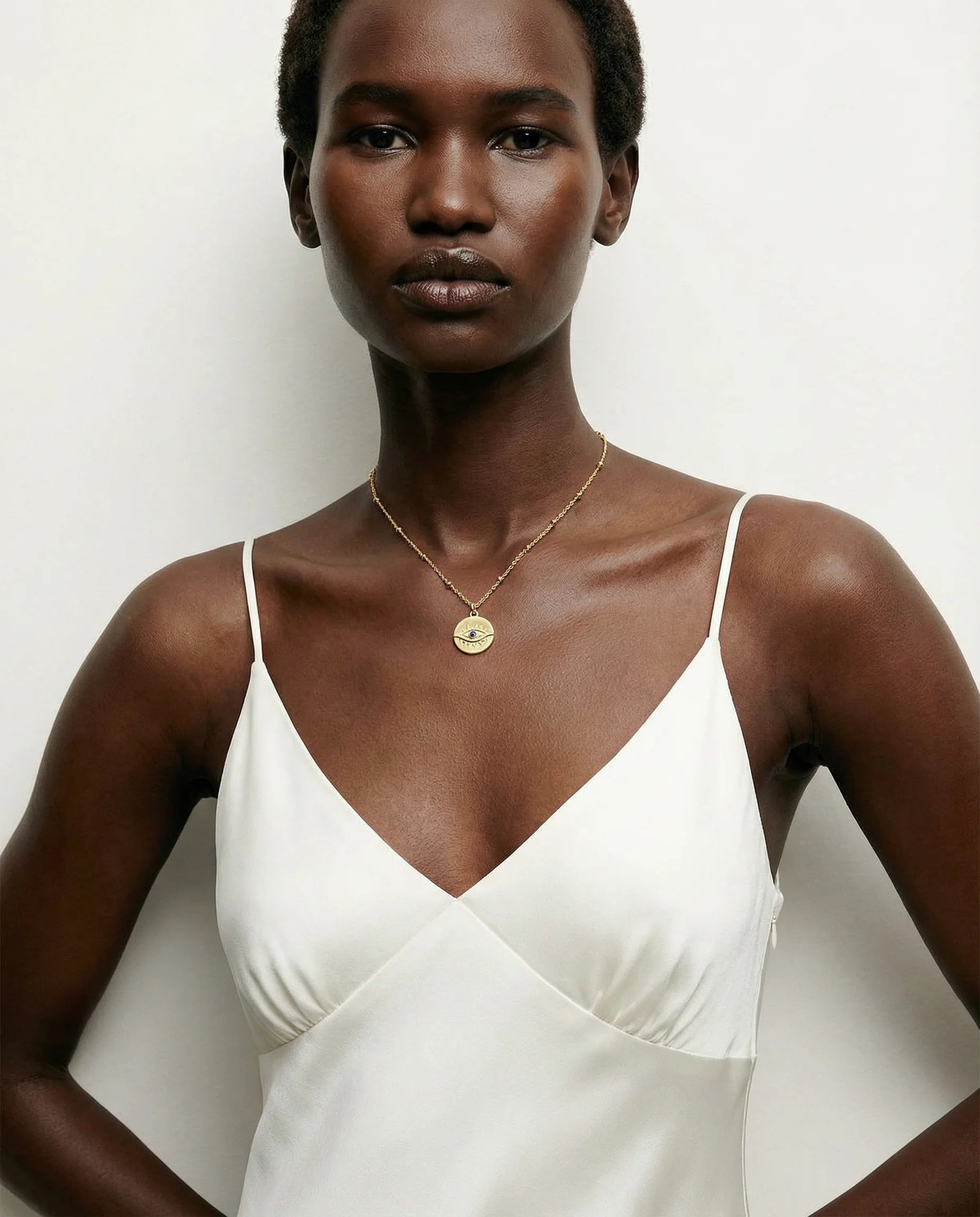 Protection Gold Pendant Necklace by Frequency Paris-Ibiza worn on model – 18K gold plated sterling silver pendant as statement centrepiece. Frequency Paris-Ibiza