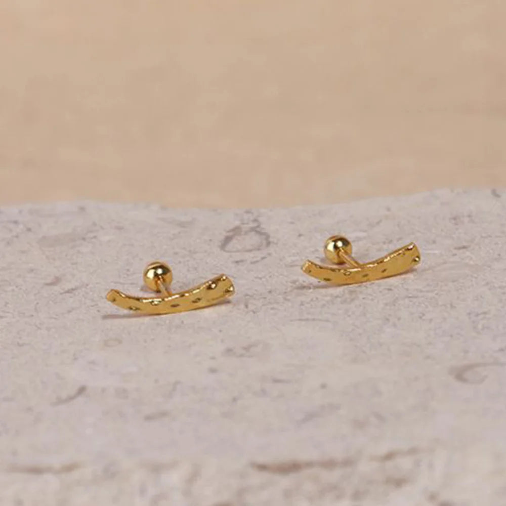 Frequency Paris-Ibiza Soluna Stud Earrings close-up, showing irregular hand-hammered texture, 18K gold plated sterling silver, minimalist style