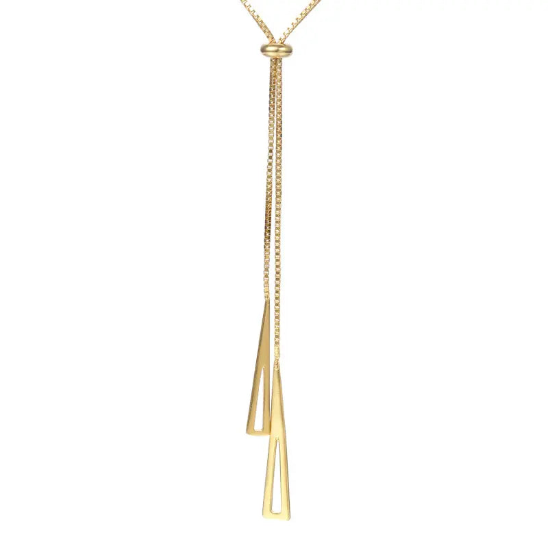 Radiance Gold Chain Necklace displayed on white background — adjustable gold chain with geometric triangle motifs and central bead. Frequency Paris-Ibiza